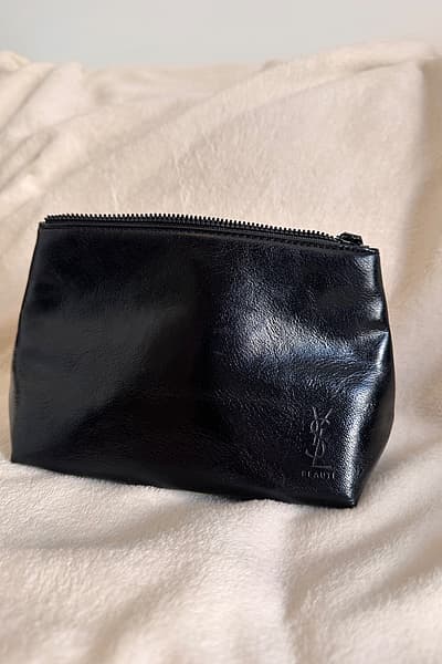 Yves Saint Laurent Black Pouch by Yves Saint Laurent — pre-loved on Thrifted.mt