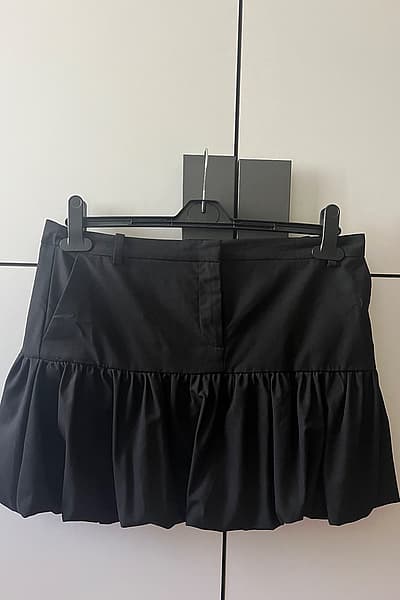 Black bubble Mango mini skirt by Mango — pre-loved on Thrifted.mt