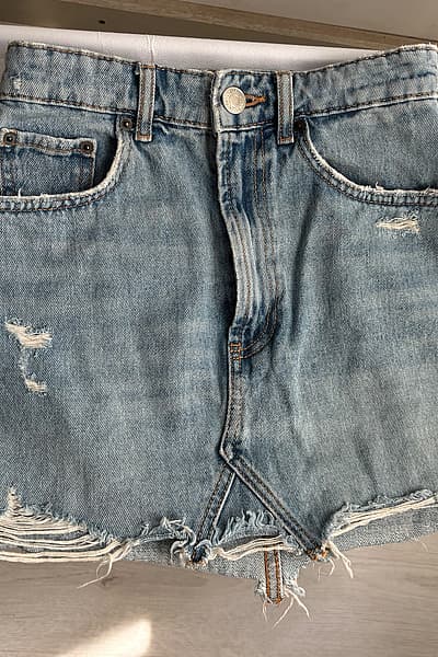 Distressed Light Wash Denim Skirt by Zara — pre-loved on Thrifted.mt