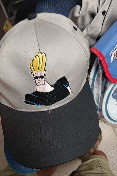 Vintage 2001 Johnny Bravo Cartoon Cap Marini Silvano by Johnny Bravo — pre-loved on Thrifted.mt