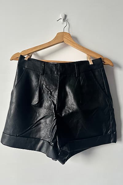 Black faux leather shorts by SHEIN — pre-loved on Thrifted.mt