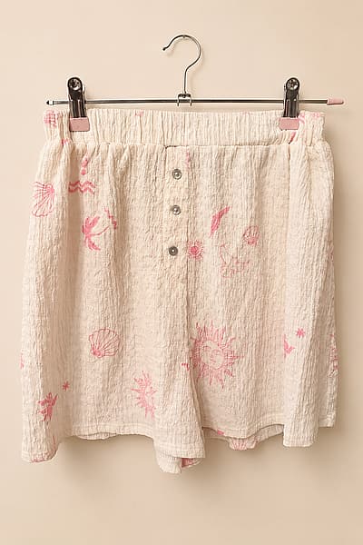 Cream Printed Beach Shorts by Kiabi — pre-loved on Thrifted.mt
