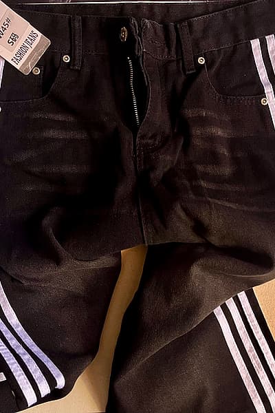 Black jeans with white stripes on the side  by SHEIN  — pre-loved on Thrifted.mt