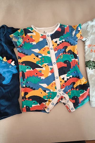 Baby dinosaur print rompers set by Mothercare — pre-loved on Thrifted.mt