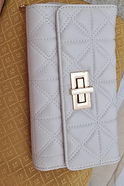 Quilted Faux Leather Twist Lock Wallet by Primark — pre-loved on Thrifted.mt