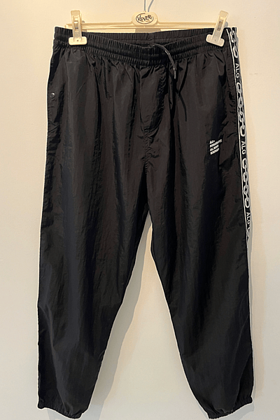 Black Taped Tracksuit Bottoms by ÀLG — pre-loved on Thrifted.mt