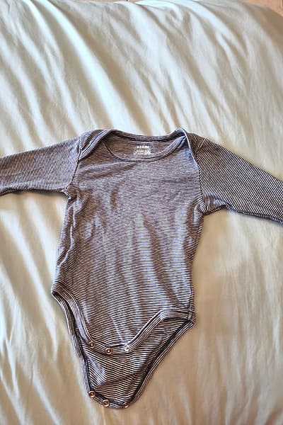 striped long-sleeve baby bodysuit by Kiabi — pre-loved on Thrifted.mt