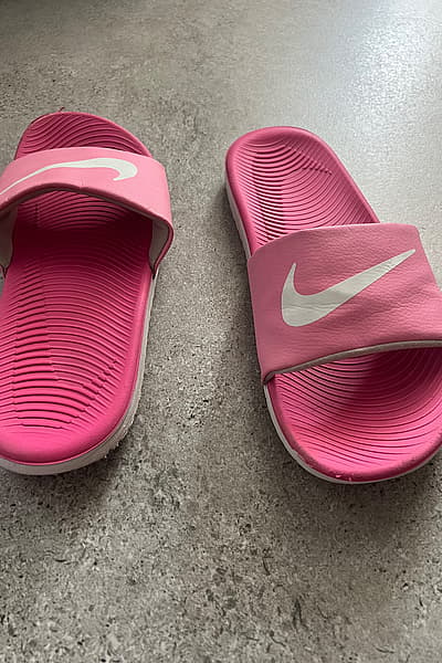 Nike Pink Logo Slides by Nike — pre-loved on Thrifted.mt
