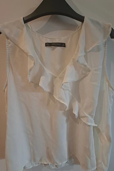 Zara ruffled white sleeveless top by Zara — pre-loved on Thrifted.mt