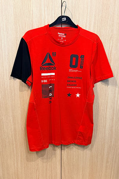 Reebok Graphic Sports Tee by Reebok — pre-loved on Thrifted.mt