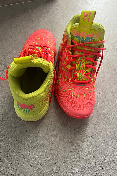 Puma vibrant high-top sneakers by Puma — pre-loved on Thrifted.mt