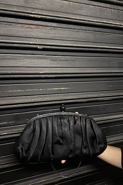 Black Ruched Satin Clutch Bag by Benvenuti — pre-loved on Thrifted.mt
