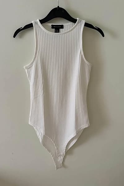 White Ribbed Sleeveless Bodysuit by New Look — pre-loved on Thrifted.mt