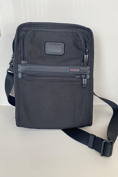 Tumi Alpha Black Crossbody Travel Bag by Tumi — pre-loved on Thrifted.mt