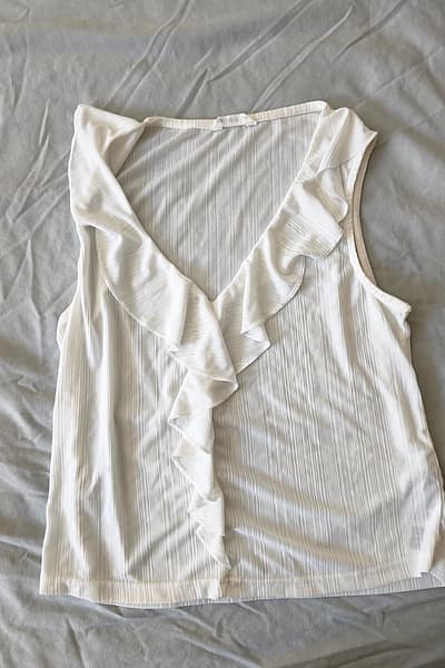 White Sleeveless Ruffle Top by Calliope — pre-loved on Thrifted.mt