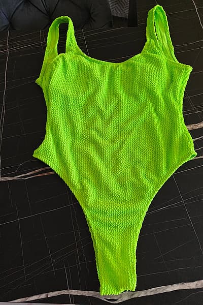 Neon green textured swimsuit — pre-loved on Thrifted.mt
