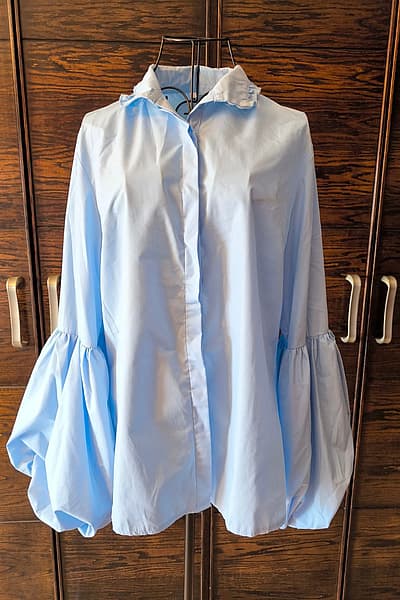 Light blue ruffle sleeve blouse — pre-loved on Thrifted.mt