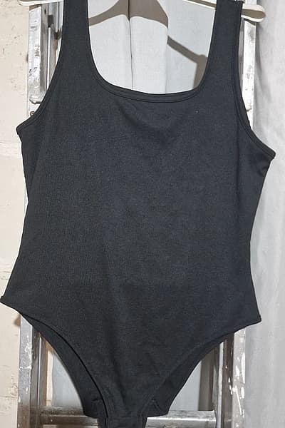 Black Ribbed Sleeveless Bodysuit by SHEIN CURVI — pre-loved on Thrifted.mt