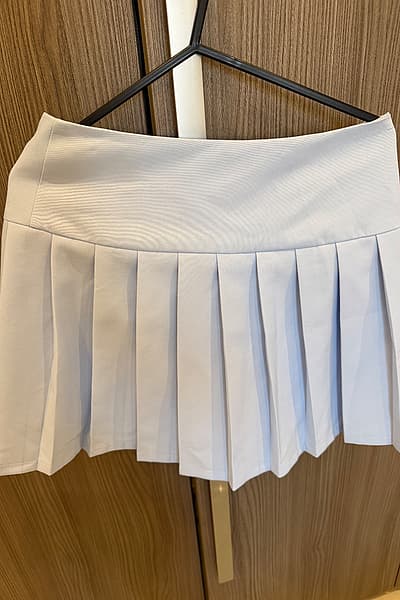 Light blue pleated mini skirt by EDAN — pre-loved on Thrifted.mt
