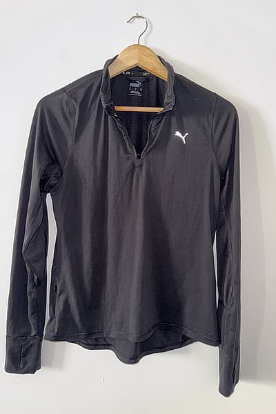 Puma Black Quarter Zip Top by Puma — pre-loved on Thrifted.mt