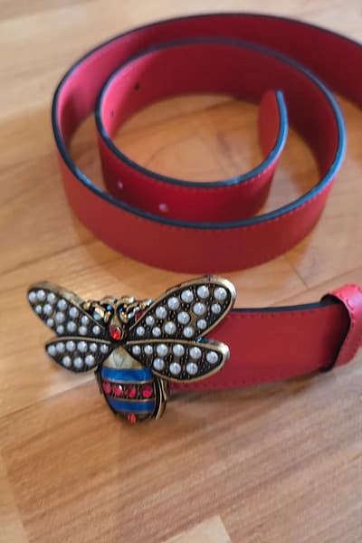 Red belt with bee buckle — pre-loved on Thrifted.mt