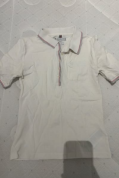 Tommy Hilfiger Slim Polo Shirt by Tommy Hilfiger — pre-loved on Thrifted.mt