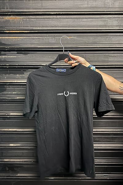 Fred Perry Black T-Shirt by Fred Perry — pre-loved on Thrifted.mt