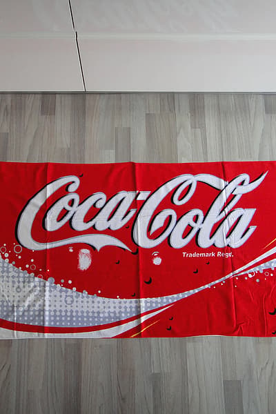 NEW Coca-Cola Beach Towel — pre-loved on Thrifted.mt