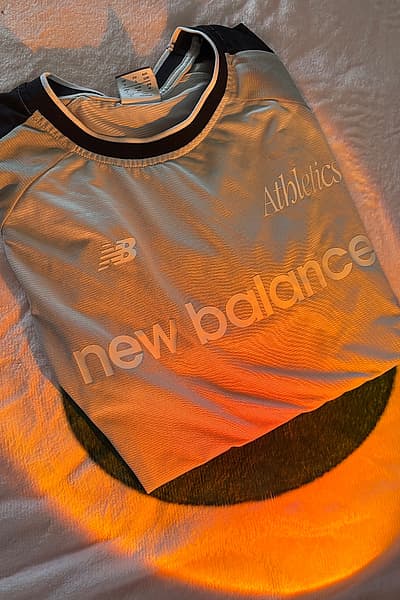 New Balance Athletics T-shirt by New Balance — pre-loved on Thrifted.mt