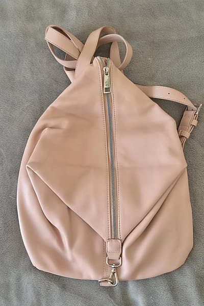 Carpisa Pink Faux Leather Backpack by Carpisa — pre-loved on Thrifted.mt