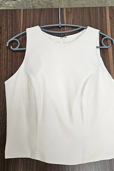 Cream Sleeveless Tailored Top by Allure Bridals — pre-loved on Thrifted.mt