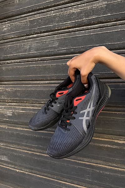 ASICS Netball Black & Coral Trainers by ASICS — pre-loved on Thrifted.mt